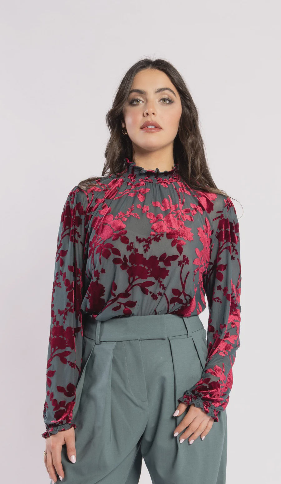 Ruffled high – neck blouse